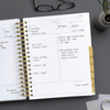 Day Designer 2024-25 daily planner: Charcoal Bookcloth opened with writing on it