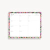 weekly planning pad with pink, purple, red, green floral border on a white background