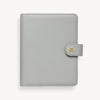 A5 gray binder closed with snap closure and gold Day Designer logo