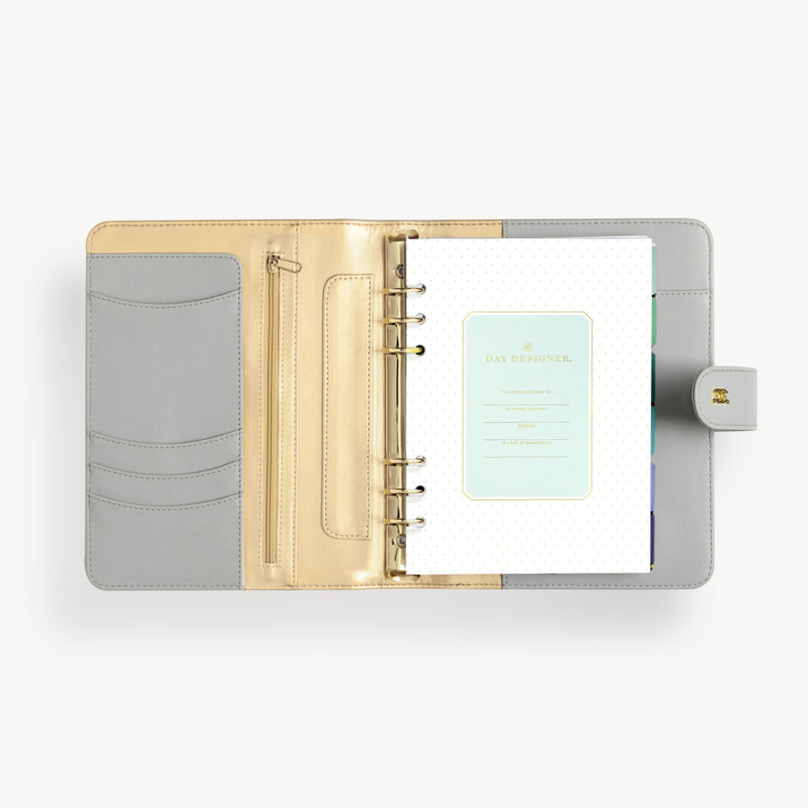 A5 gray binder open to show gray and gold liner with pockets, zipper and  starter insert pack