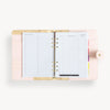 Blush binder open to show blush and gold interior with pockets and zipper and big to do insert pages