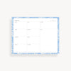 weekly planning pad with blue floral border on a white background
