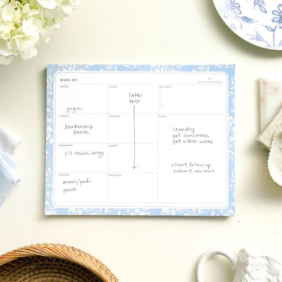 weekly planning pad with blue floral border