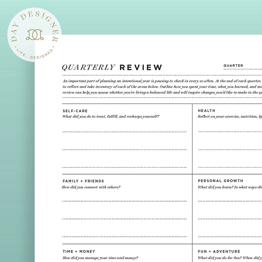 Close up image of quarterly review printable on a mint background