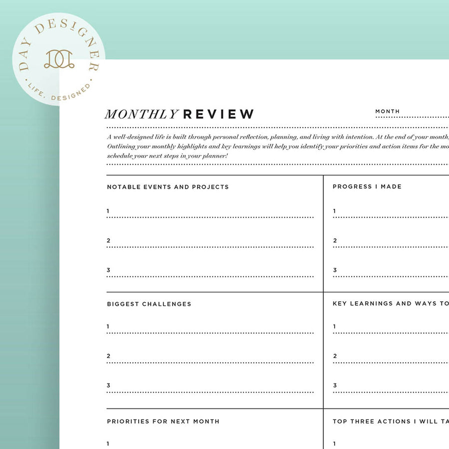 Close up of Monthly Review Printable on a mint green background