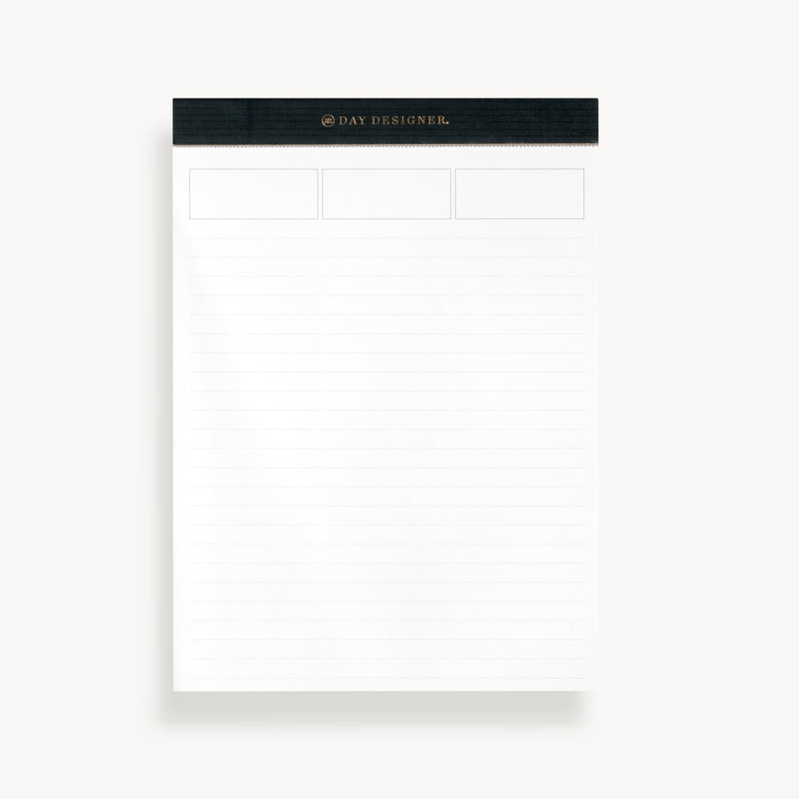 Planning pad with black and gold trim with lined notepad layout and header prompts.