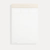Planning pad with blush and gold trim with lined notepad layout.