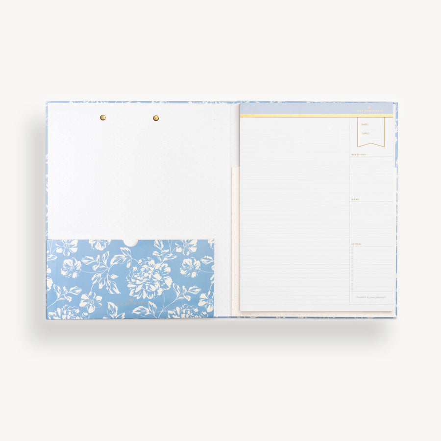 blue floral clipfolio, open to show interior pocket and lined notepad 