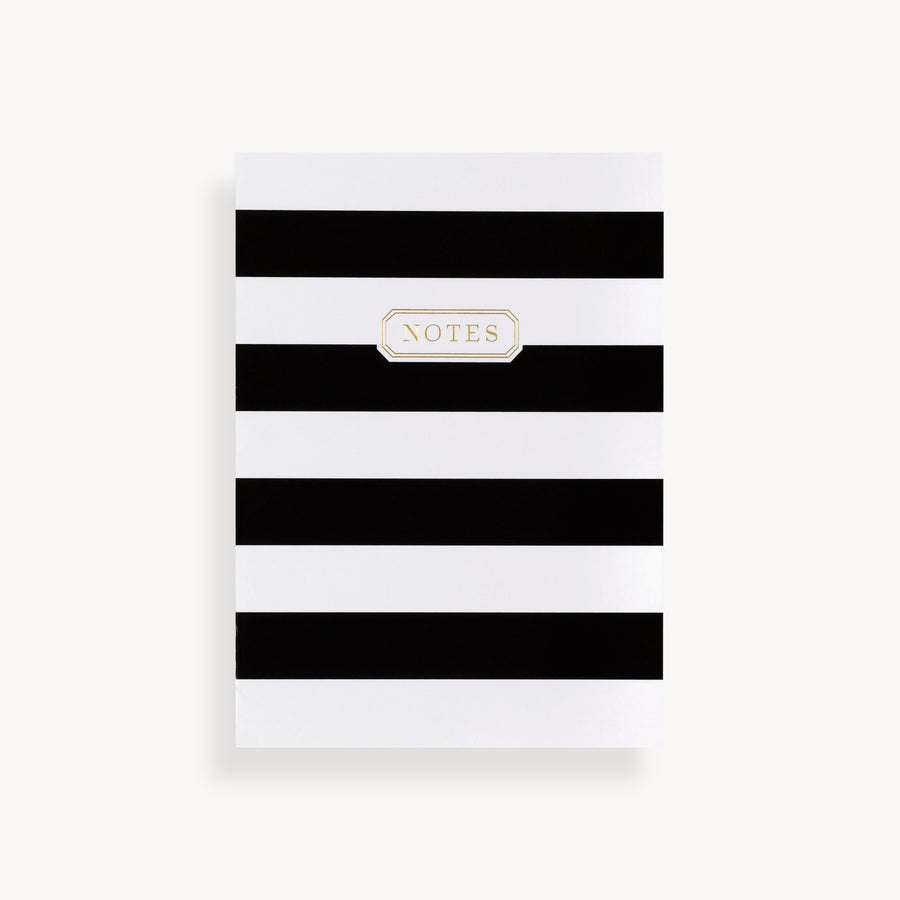 slim mini notebook with black and white stripe pattern cover and gold accents 