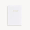 slim mini notebook with white swiss dot pattern cover and gold accents 