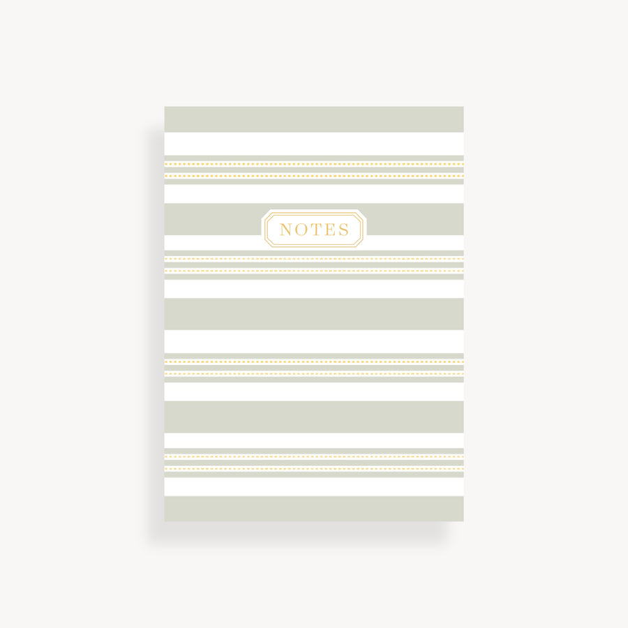 slim mini notebook with gray and white stripe pattern cover and gold accents 