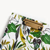 close up of tropical pattern clipfolio with gold clip on white background