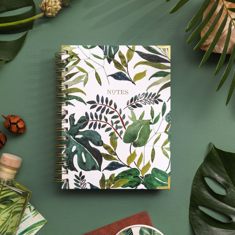 compact tropical patterned notebook on green background