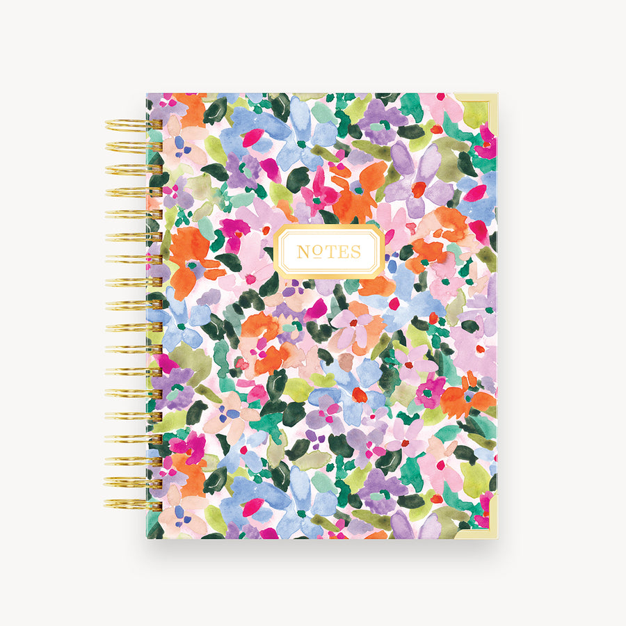 colorful floral notebook on a white background