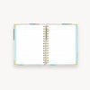 colorful abstract pattern notebook open to show lined pages