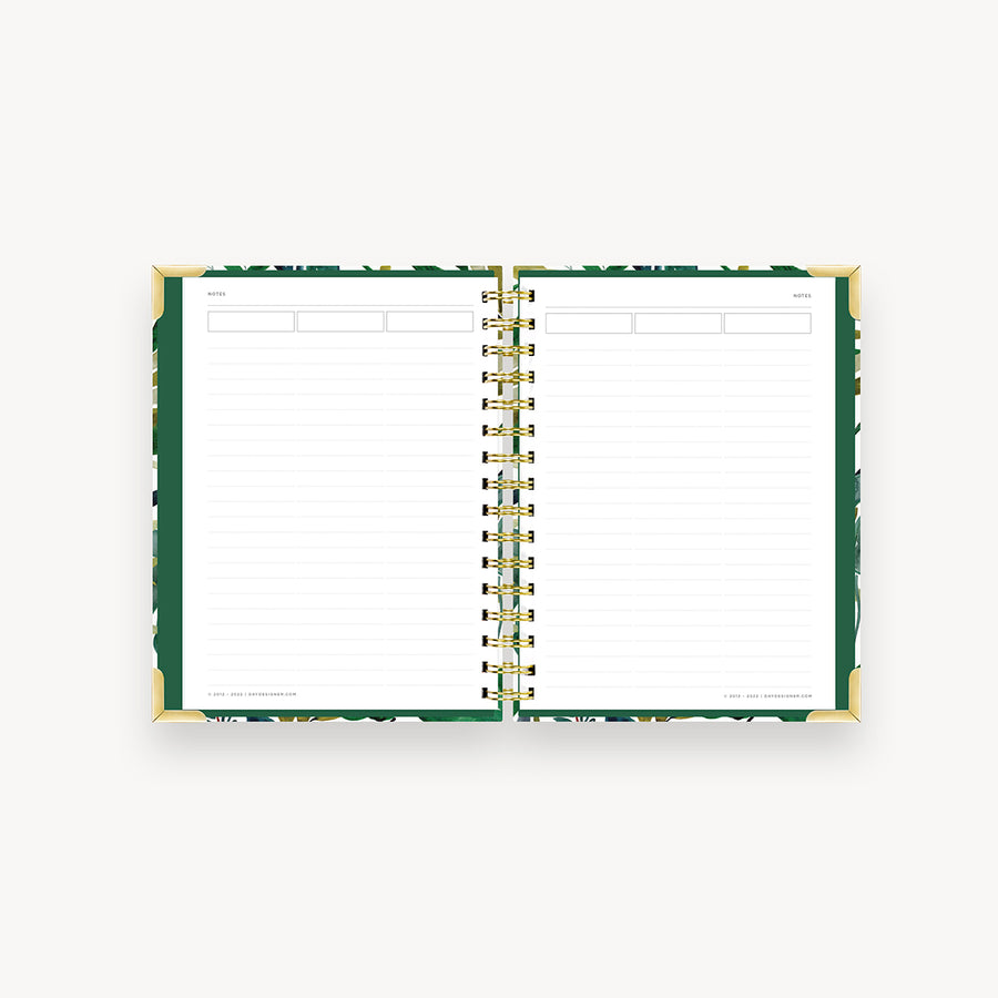 notebook open to show green liner and notes page