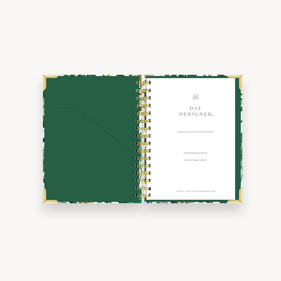 notebook open to show green pocket and title page