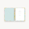 colorful painted floral design notebook open to show mint liner and pocket