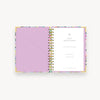 colorful painted floral pattern notebook open to show lavender lining and pocket