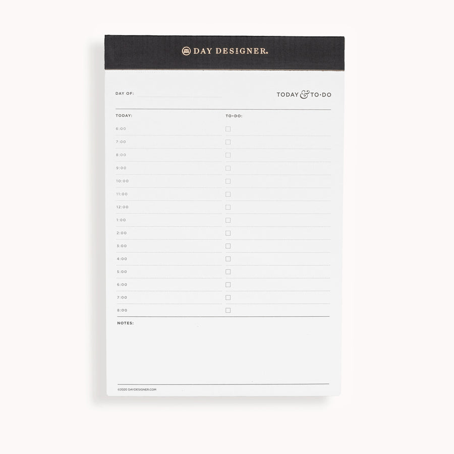 Planning pad with black and gold trim and undated daily planning layout.
