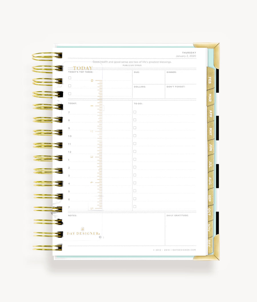 mini planner open to show clear snap-in ruler with gold type 