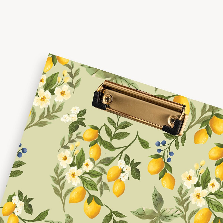 Clipboard with lemon and floral pattern on a light green background