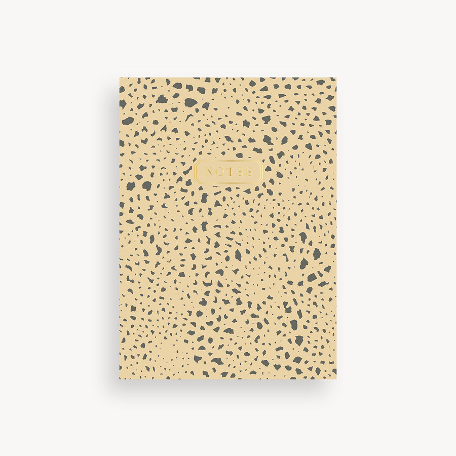 slim mini notebook with brown and tan  pattern cover and gold accents 