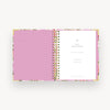 pink and green floral notebook open to pink liner