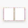 pink and green floral notebook open to lined pages