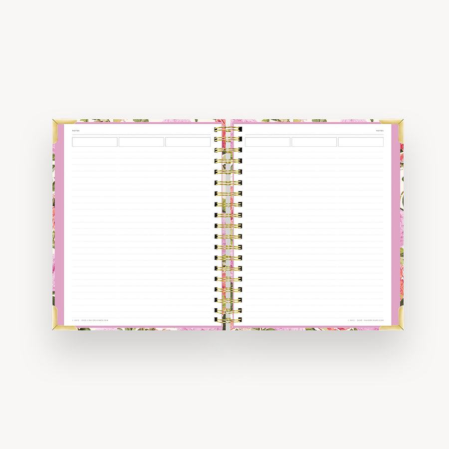pink and green floral notebook open to lined pages