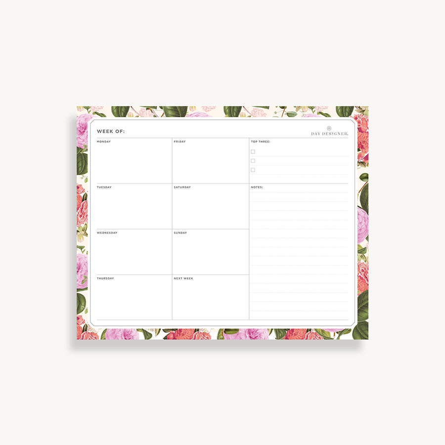 weekly planning pad with pink and green floral border on a white background