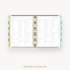 Day Designer 2026 weekly planner: black stripe cover with packing checklist