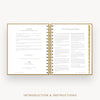 An open spiral-bound booklet with gold-toned rings and gold border lines, showing printed introduction and instructions text on white pages. The image is centered on a light gray background with the words 'INTRODUCTION & INSTRUCTIONS' below.