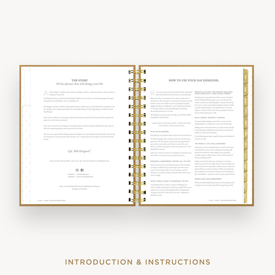 An open spiral-bound booklet with gold-toned rings and gold border lines, showing printed introduction and instructions text on white pages. The image is centered on a light gray background with the words 'INTRODUCTION & INSTRUCTIONS' below.