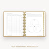 An open spiral-bound workbook showing two printed self-assessment worksheet pages, with a gold wire binding and gold text at the bottom reading 'SELF-ASSESSMENT WORKSHEETS'.