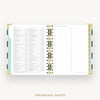 An open spiral-bound planner or agenda on a light gray background, showing a detailed monthly calendar page with columns for days, notes, and checkboxes. The planner has gold-toned rings, white pages, and pastel side tabs.
