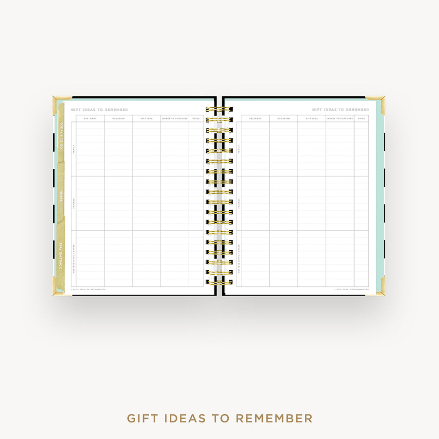 An open spiral-bound planner or notebook with a gift ideas to remember page spread, shown on a light gray background with the text 'GIFT IDEAS TO REMEMBER' below.