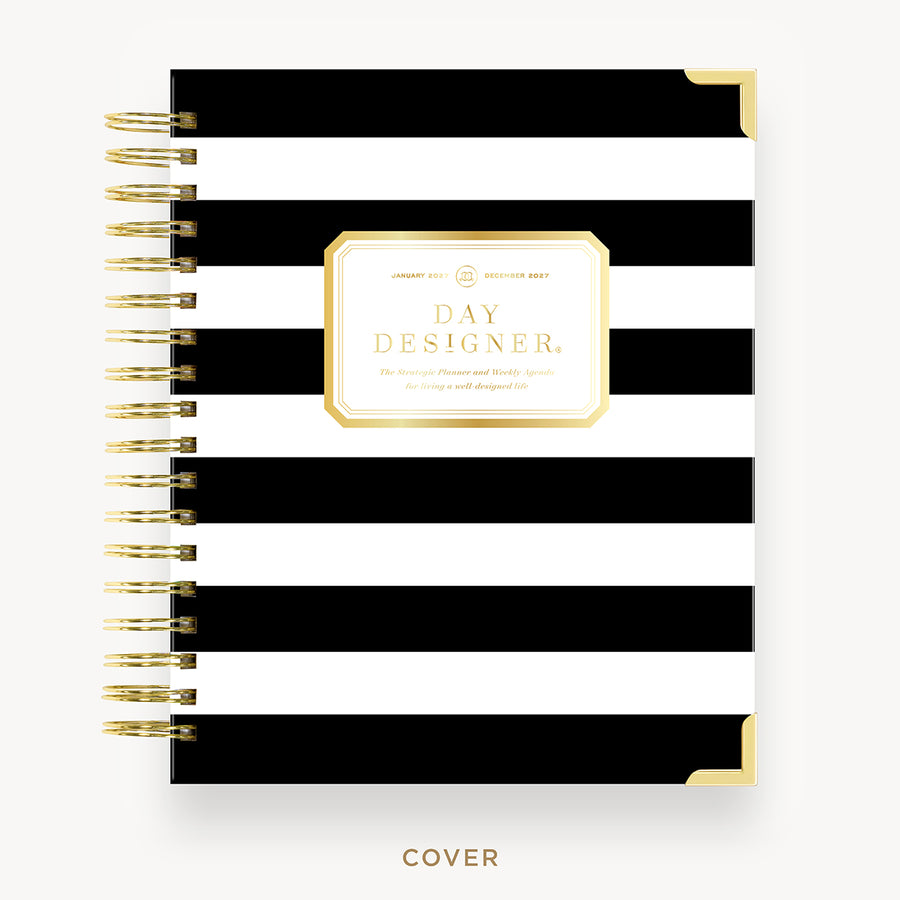Black and white striped notebook with gold accents on a white background