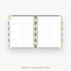 An open weekly planner page with gold spiral binding, shown on a light gray background with the text 'WEEKLY PLANNING PAGE' below.