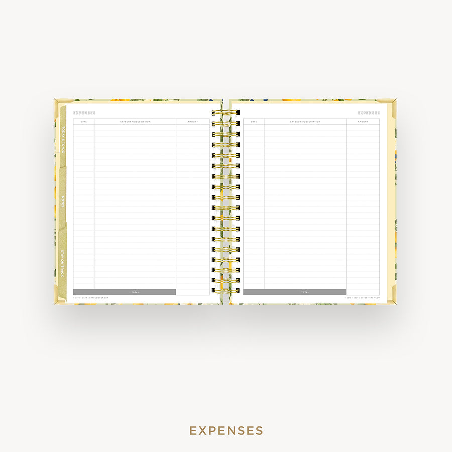An open spiral-bound planner showing a clean expenses page with lined columns, set against a light gray background with the word 'EXPENSES' below.