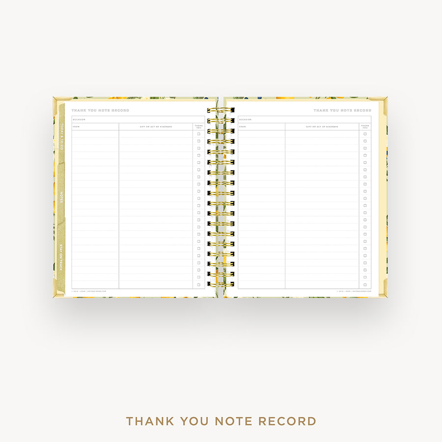 An open spiral-bound thank you note record planner with lined pages and a gold-toned metal coil, shown on a light gray background with the text 'THANK YOU NOTE RECORD' below.