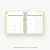 An open tabbed monthly calendar planner on a light gray background, showing a January 2027 calendar spread with gold spiral binding and a subtle floral pattern on the cover.