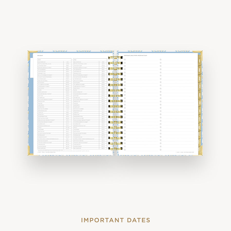An open spiral-bound planner or agenda with white pages, light blue headers, and gold accents, shown on a light gray background with the text 'IMPORTANT DATES' below.