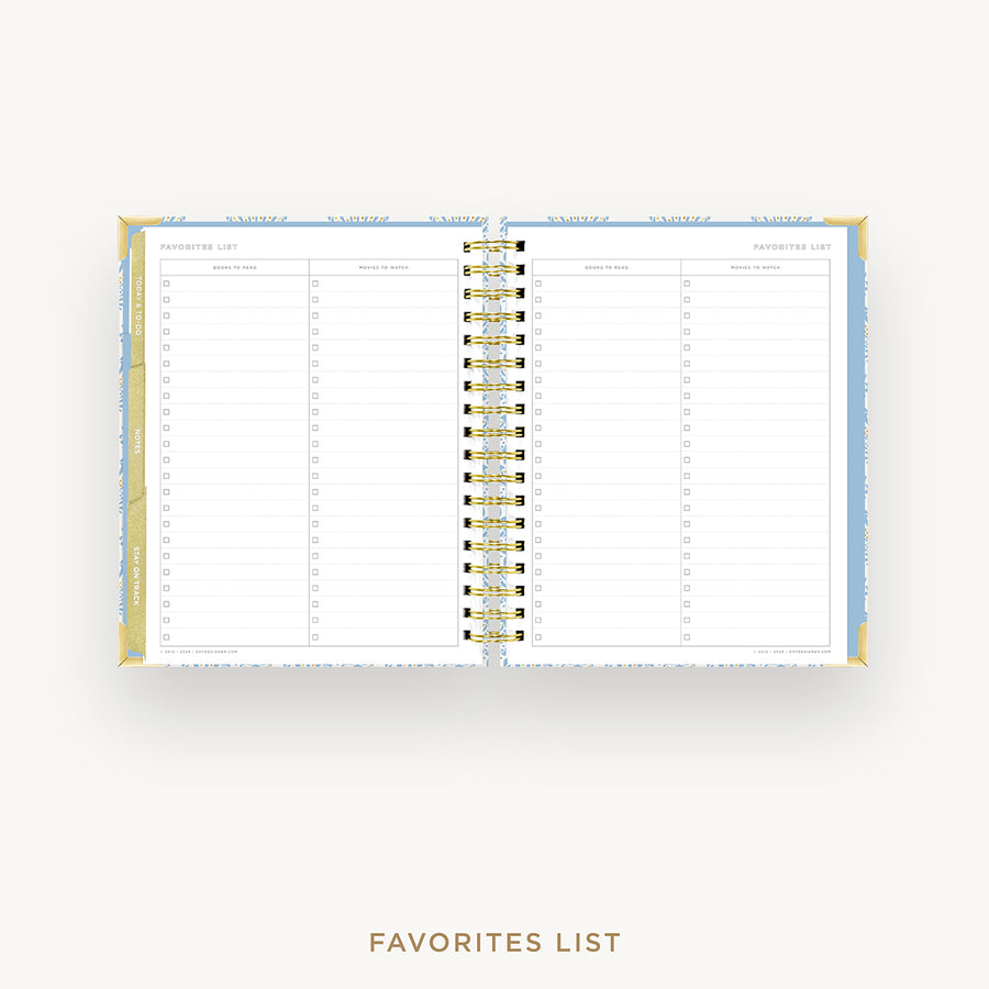 An open spiral-bound planner or agenda showing a favorites list page layout, photographed on a clean light gray background with the words 'FAVORITES LIST' below.