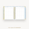 An open spiral-bound planner or notebook with a gift ideas to remember grid layout, shown on a light gray background with the text 'GIFT IDEAS TO REMEMBER' below.