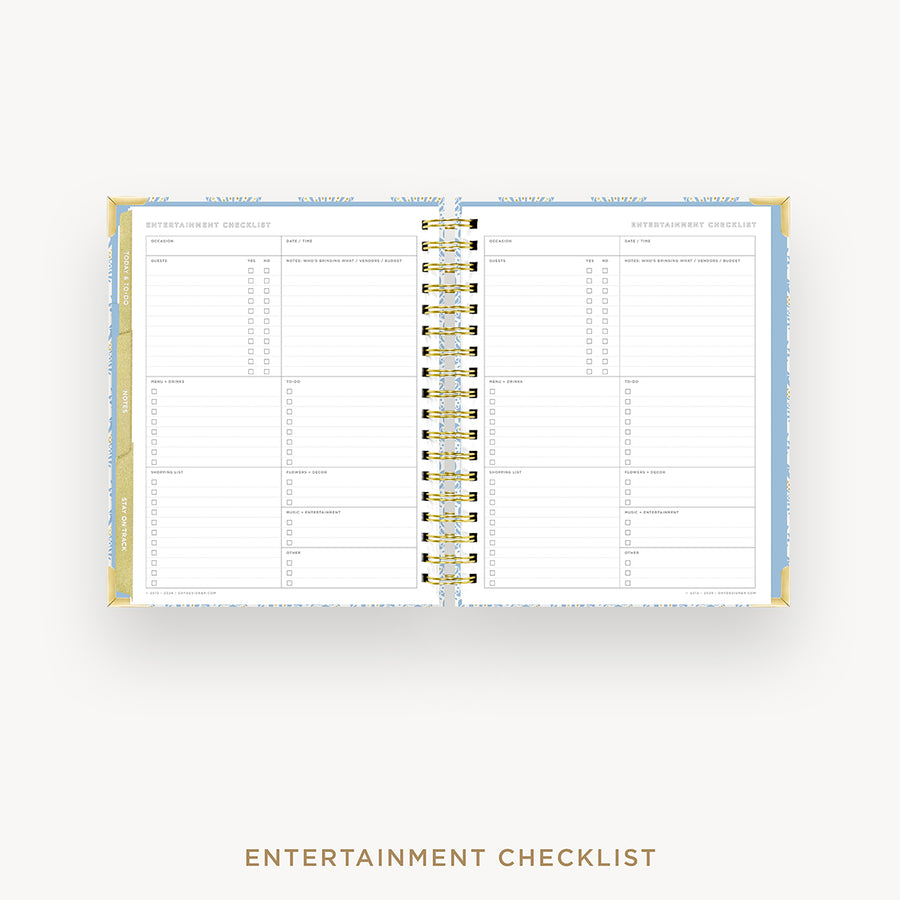 An open spiral-bound planner or checklist book showing the Entertainment Checklist page, photographed on a light gray background with the text 'ENTERTAINMENT CHECKLIST' below.