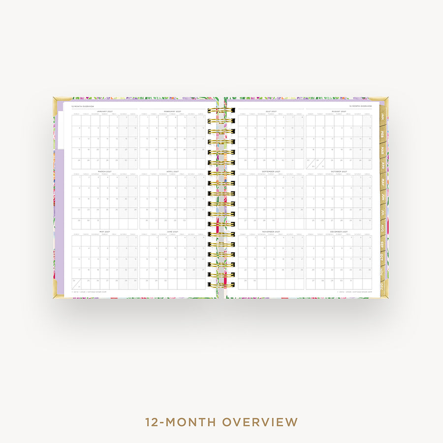 An open 12-month spiral planner or calendar showing a monthly overview layout, photographed on a clean white background with the text '12-MONTH OVERVIEW' below.