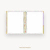 An open spiral-bound planner or notebook with lined white pages, shown on a light gray background. The cover has a delicate pastel floral border, and the text 'NOTES PAGES' appears below.