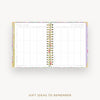 An open spiral-bound planner or notebook with a floral-patterned cover and white interior pages, shown on a light gray background with the text 'GIFT IDEAS TO REMEMBER' below.
