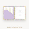 Open planner showing a pocket, stickers, and ruler on a white background